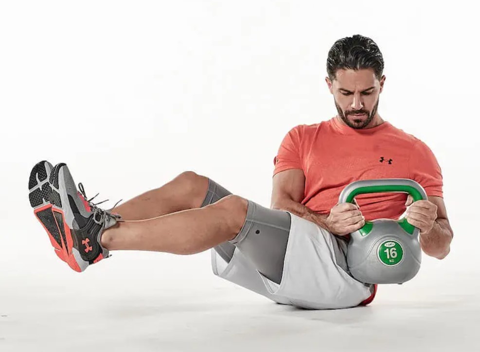 Man performing a kettlebell Russian twist