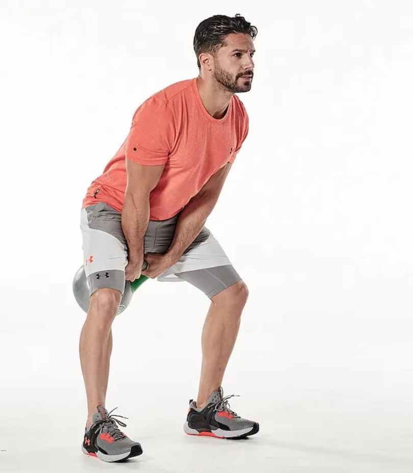 Man performing a kettlebell workout