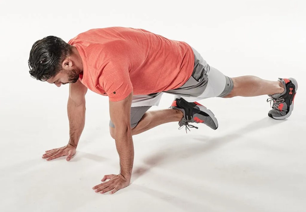 Man performing a mountain climber exercise