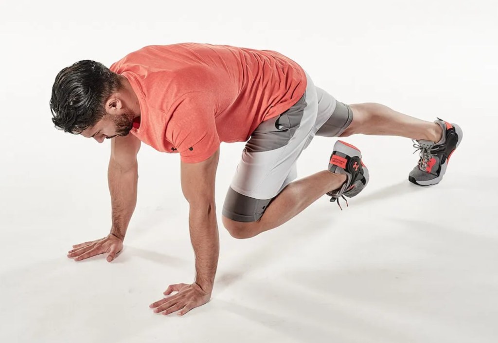 Man performing a mountain climber exercise