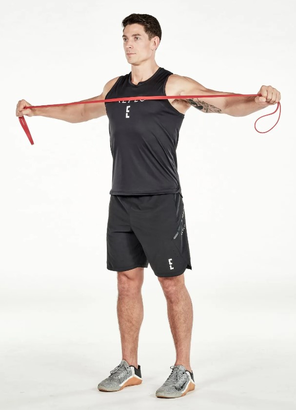 Man performing a resistance band pull-apart