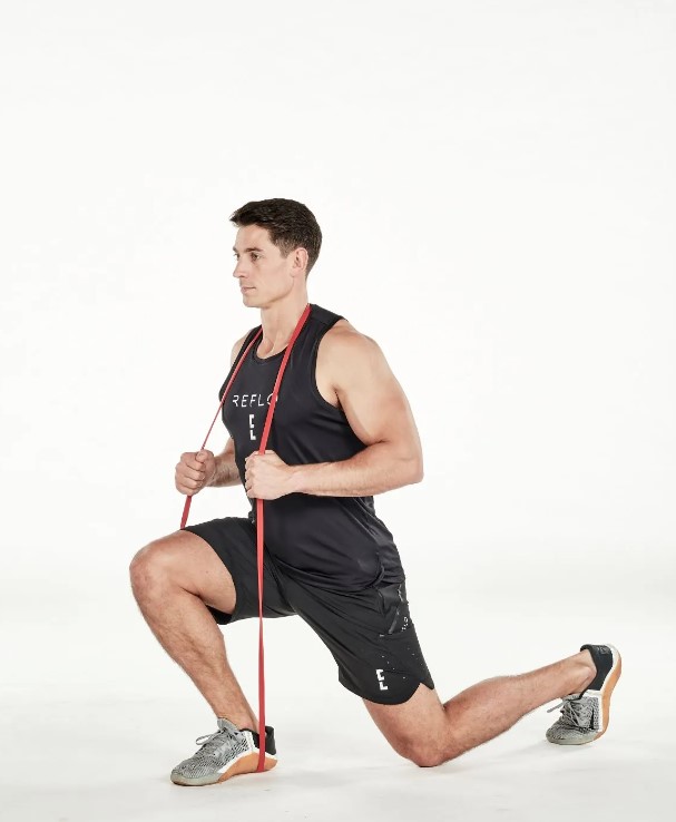 Man performing a resistance band split squat