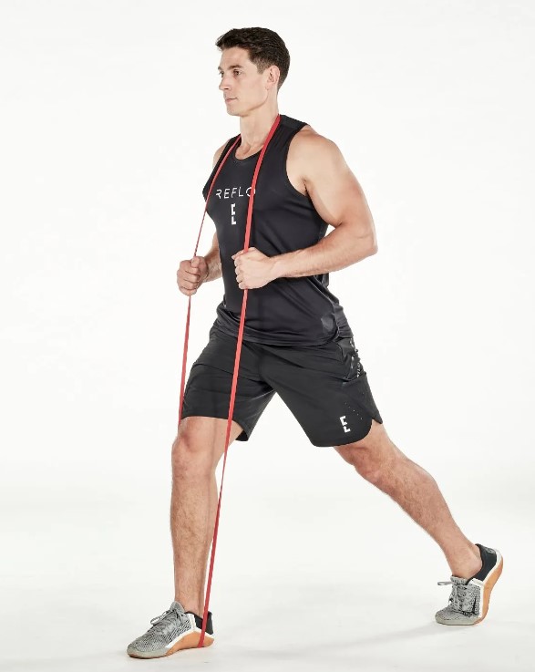 Man performing a resistance band split squat