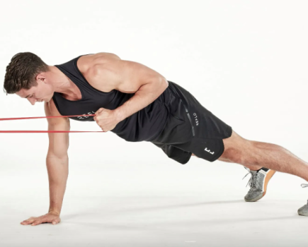 Man performing resistance band exercises