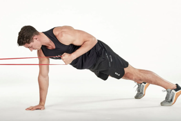 Man performing resistance band exercises