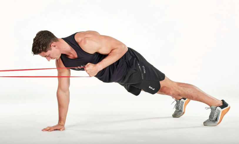 Man performing resistance band exercises