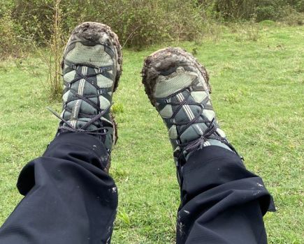 Close-up of a pair of feet wearing Salomon hiking boots