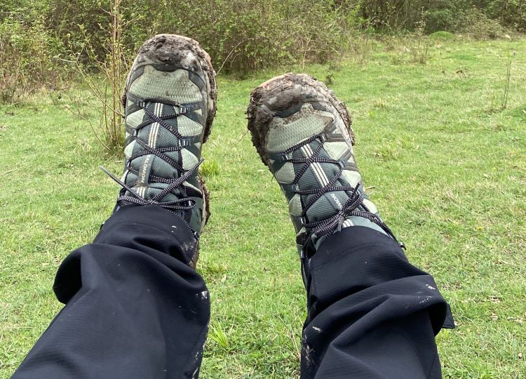 Close-up of a pair of feet wearing Salomon hiking boots