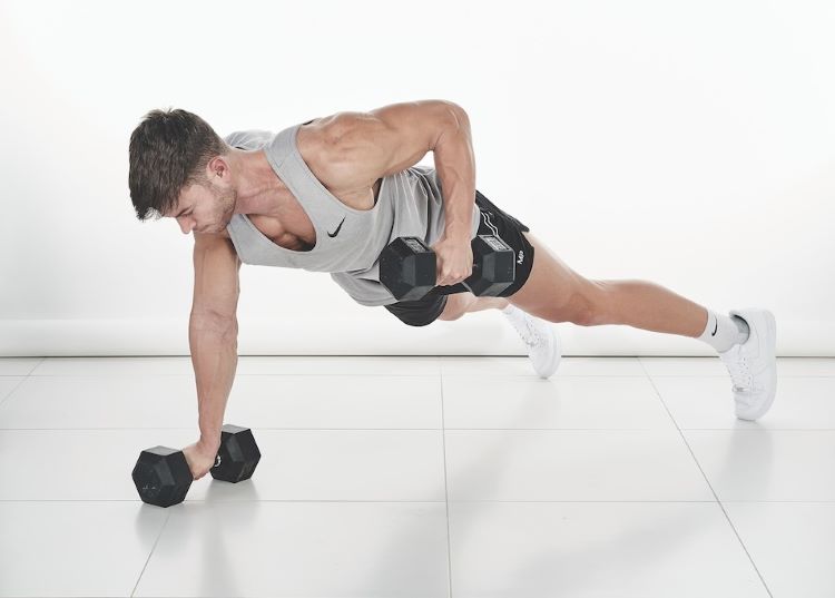 Man performing a dumbbell renegade row