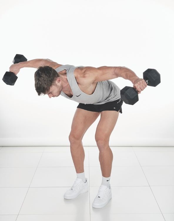 Man performing a reverse dumbbell flye