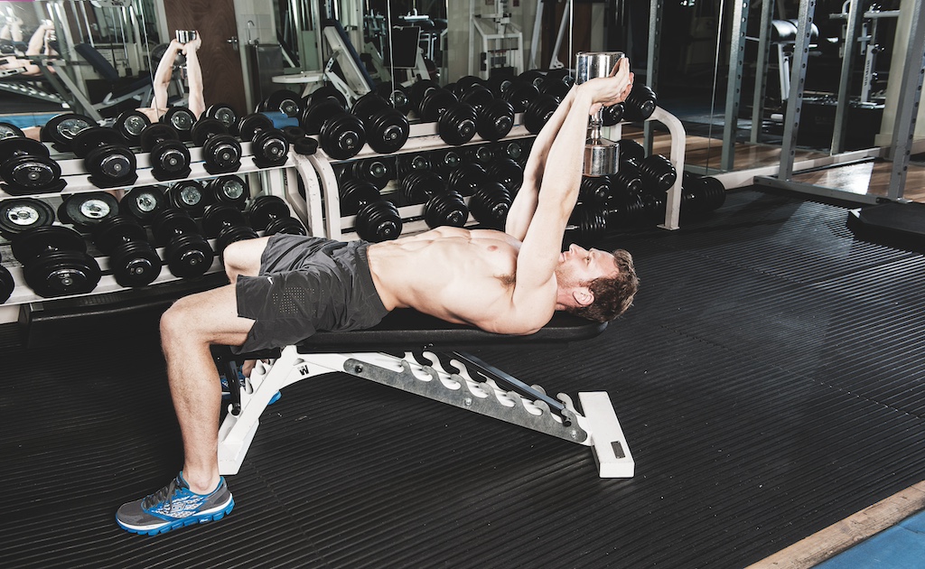 man showing how to do a dumbbell pull-over