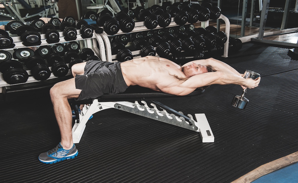 man showing how to do a dumbbell pull-over