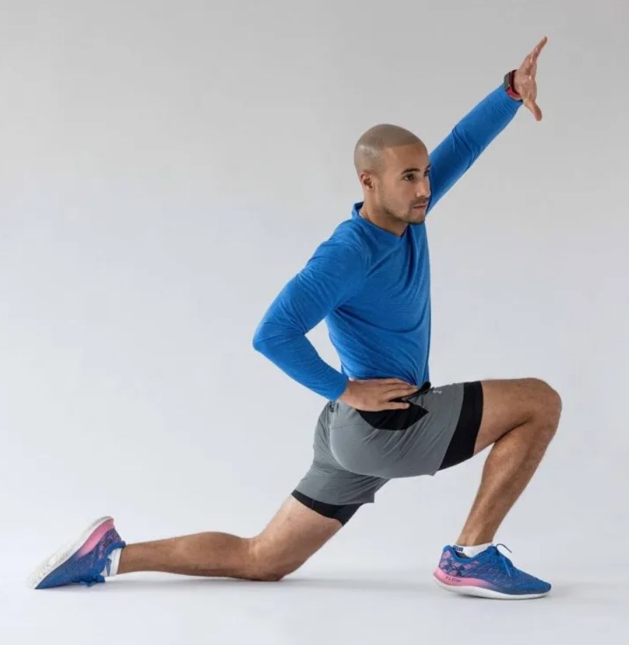 Man performing a lunge hip flexor stretch