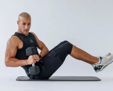 Man performing a Russian twist exercise
