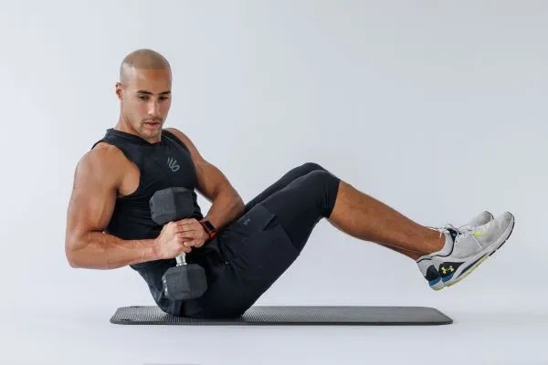 Man performing a Russian twist exercise