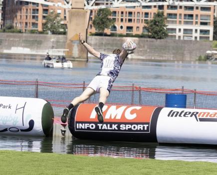 players splashes into the river during WateRugby tournament in Toulouse