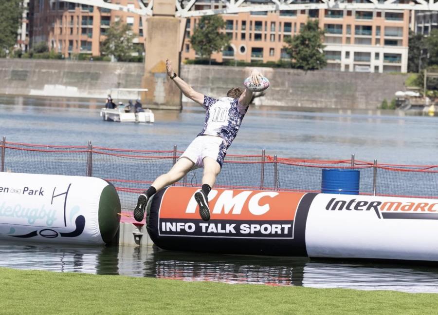 players splashes into the river during WateRugby tournament in Toulouse