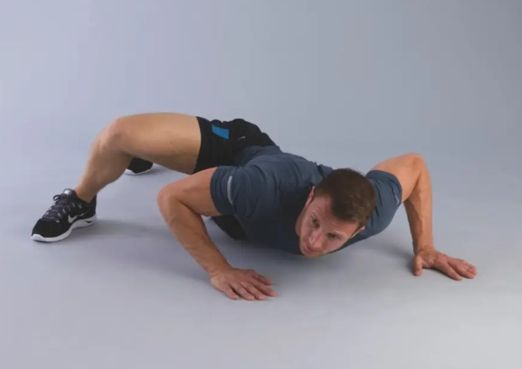 Man performing an alligator push-up