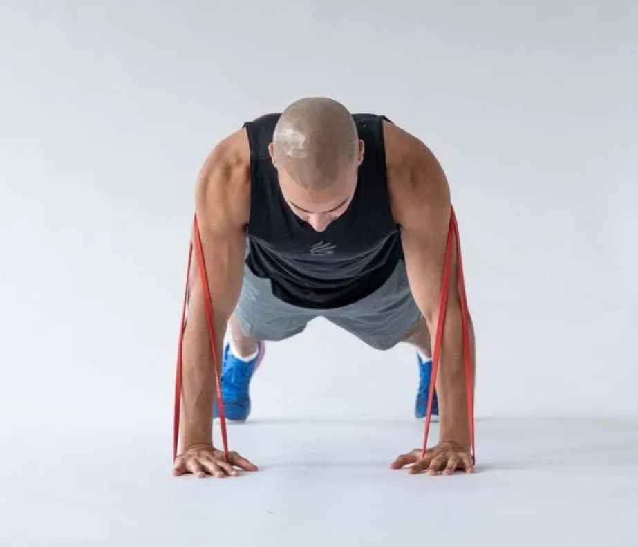 Man performing a banded push-up