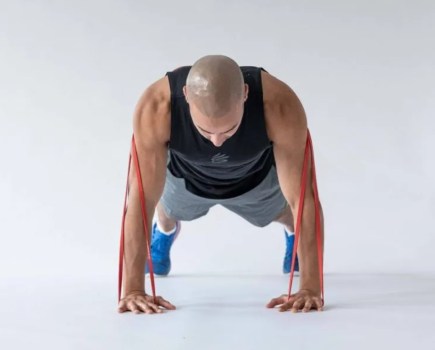 Man performing a resistance band push-up