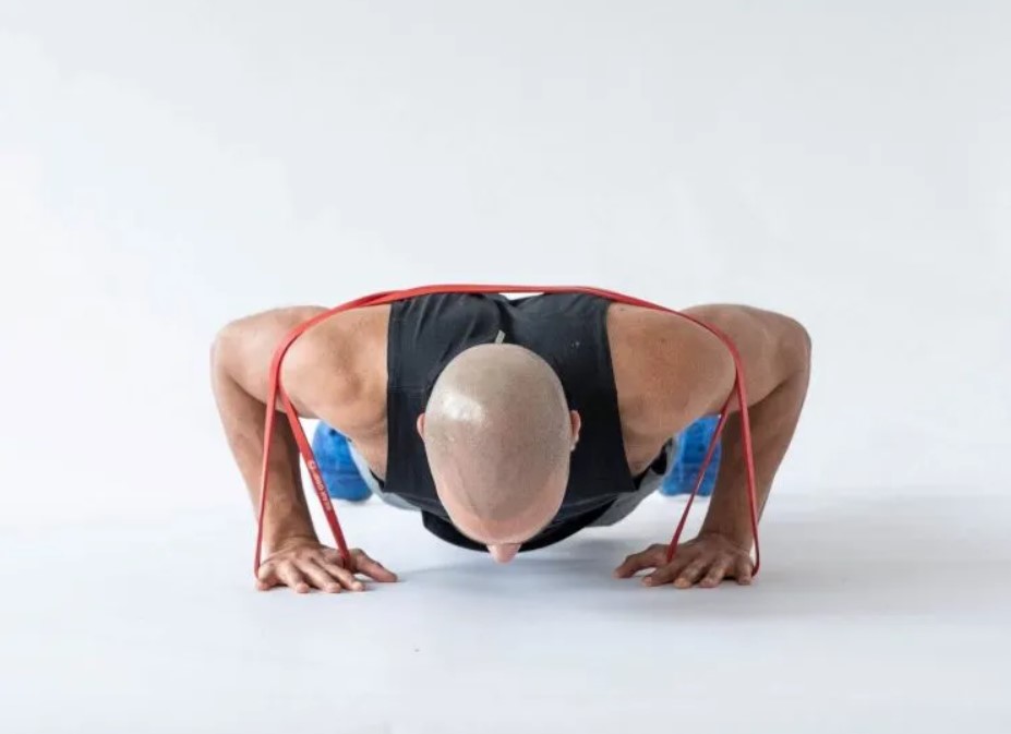 Man performing a banded push-up