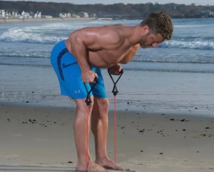 Man performing a bent over resistance band exercise