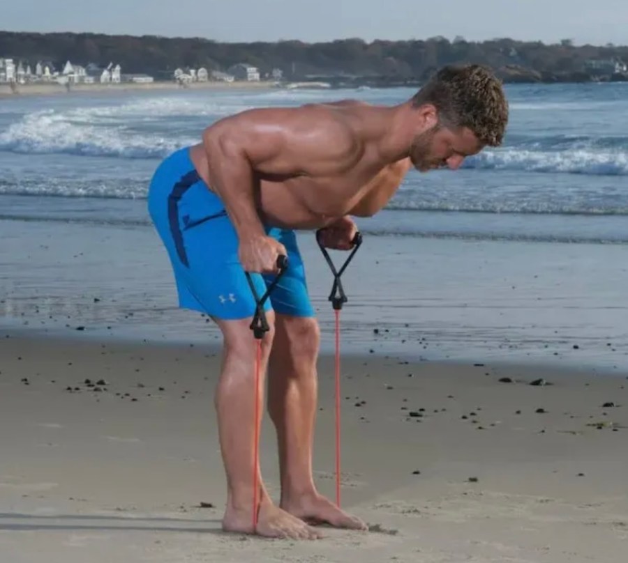 Man performing a bent over resistance band exercise