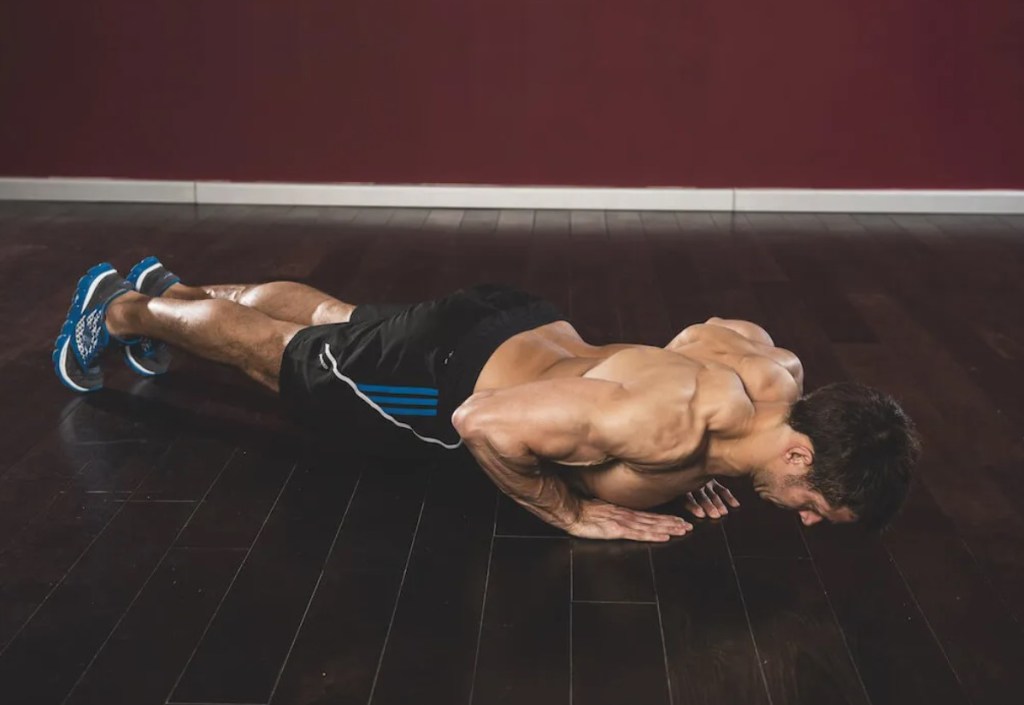 Man performing a diamond push-up exercise