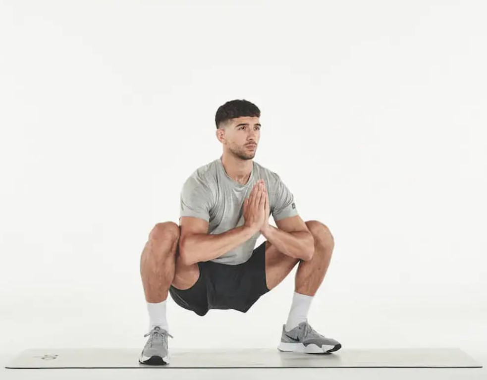 Man performing a deep squat