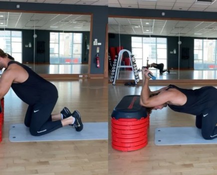 Man performing a dowel bench extension