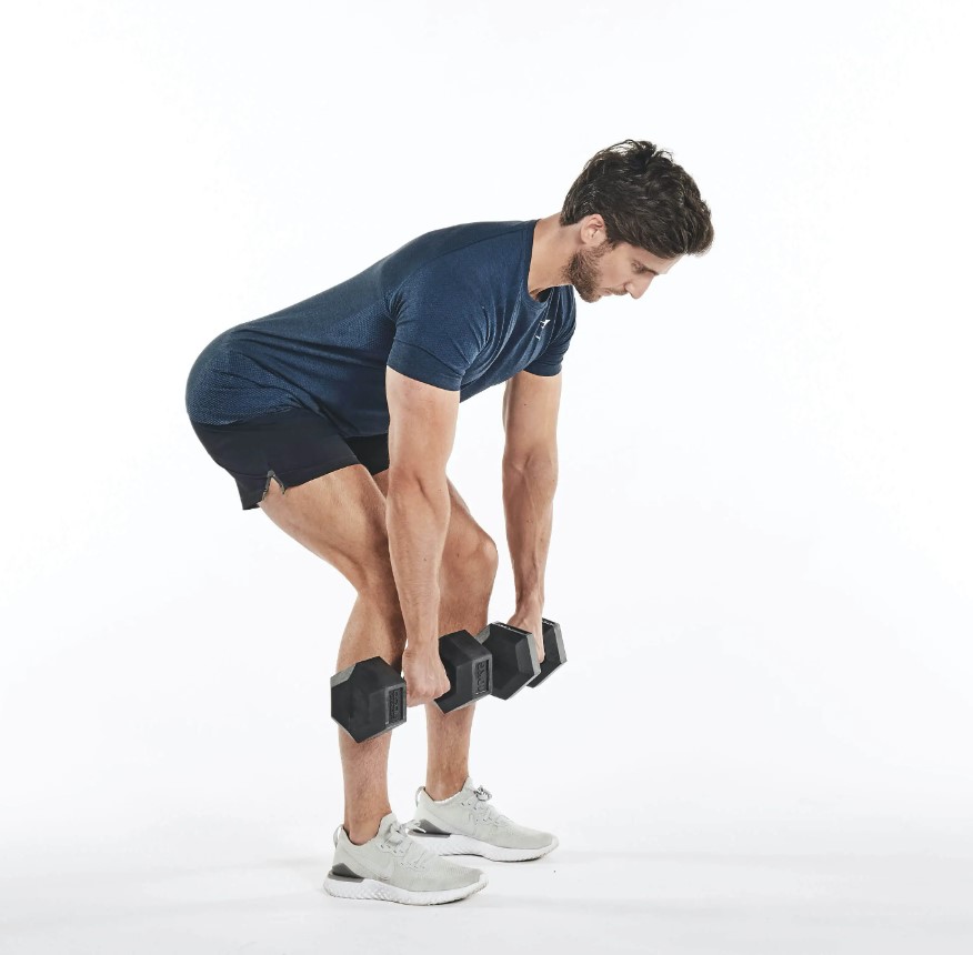 Man performing a dumbbell deadlift