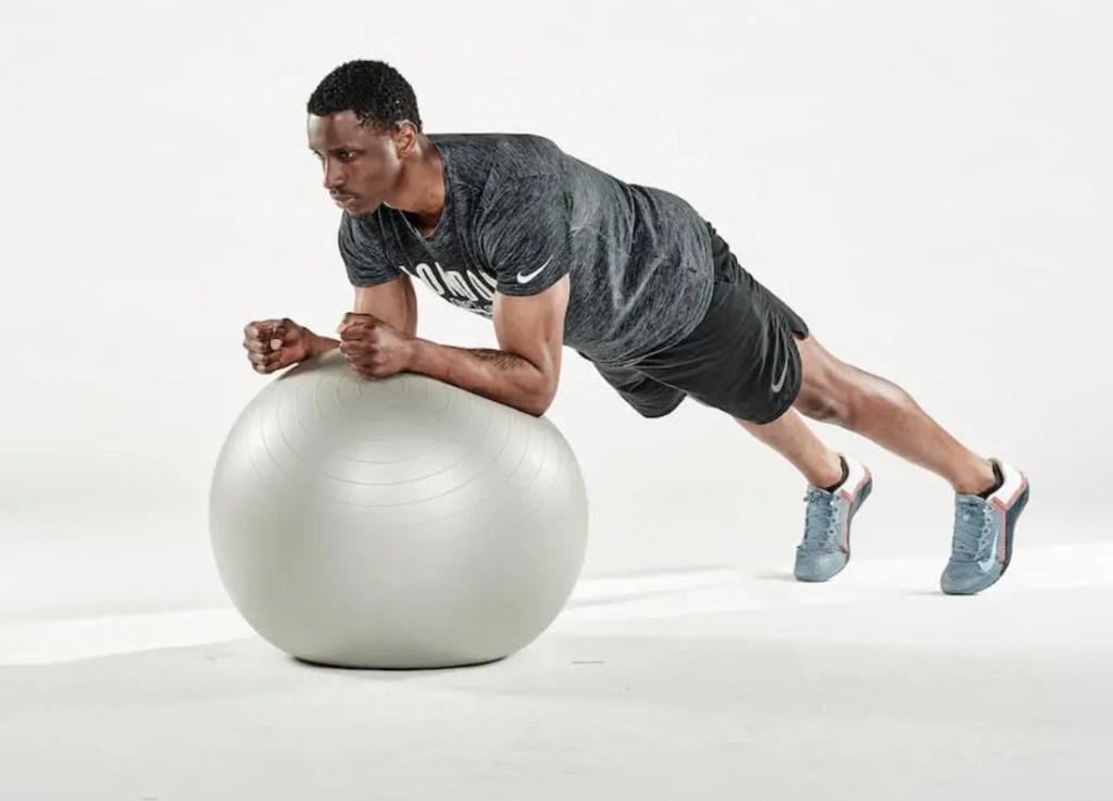 Man performing an exercise ball plank