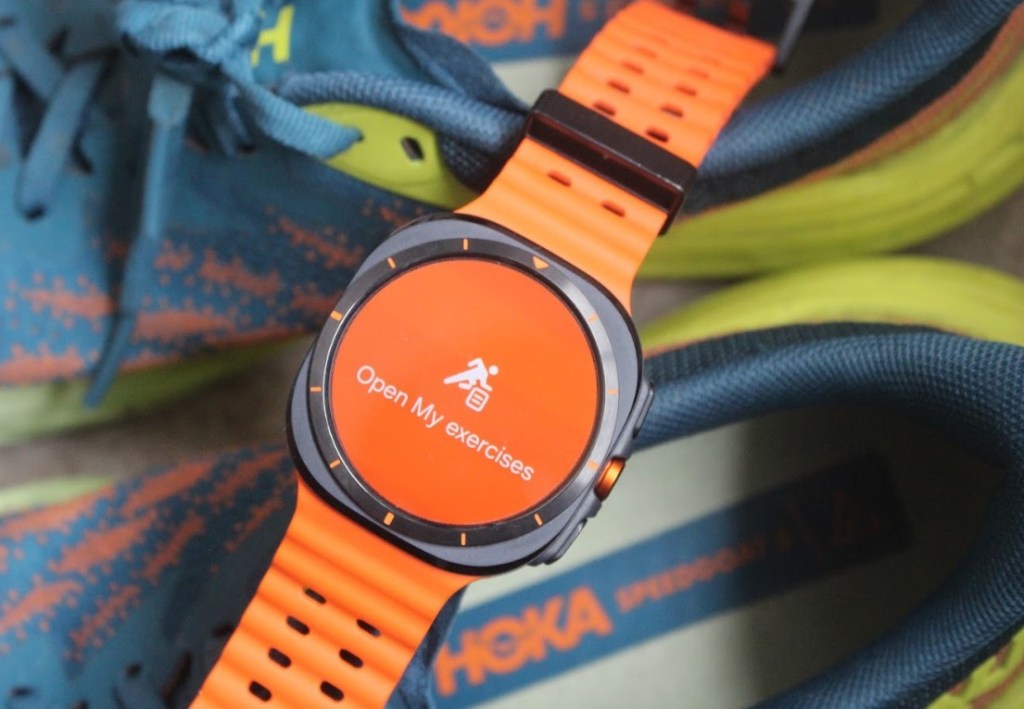 Close-up of a Samsung watch on a pair of trainers