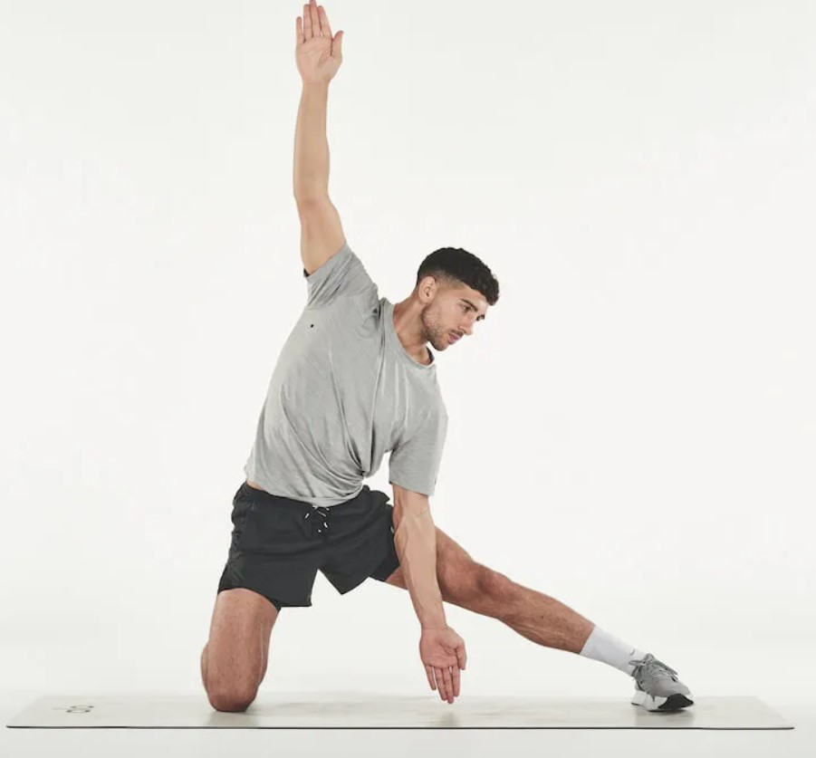 Man performing a gate yoga pose