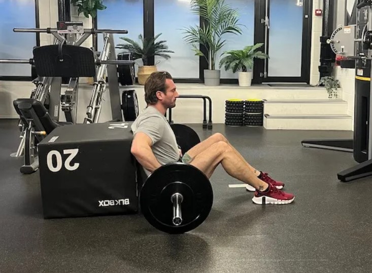 Man performing a barbell hip thrust