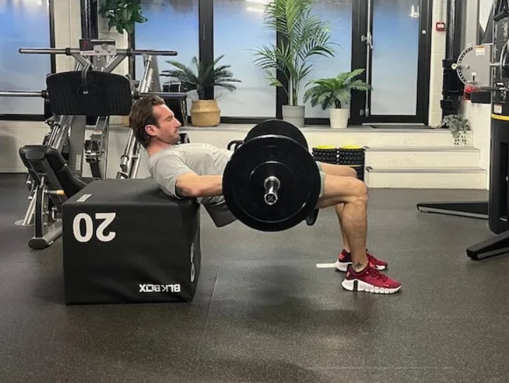 Man performing a barbell hip thrust