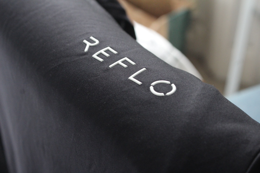 Top with Reflo logo