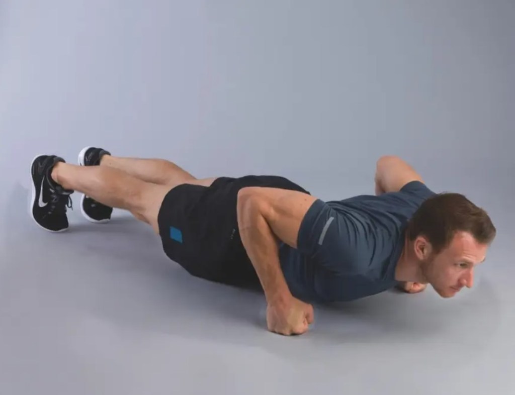 Man performing a knuckle push-up