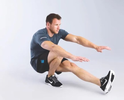 Man performing a pistol squat