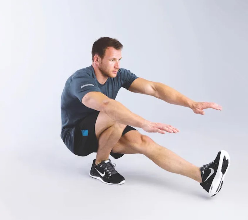 Man performing a pistol squat