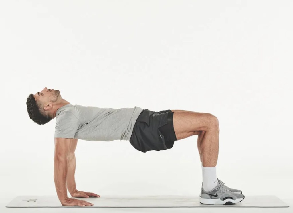 Man performing a table yoga pose