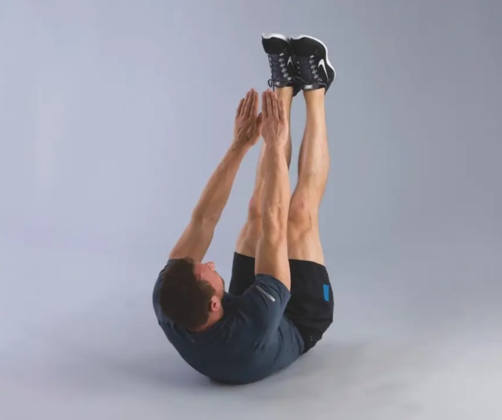 Man performing a v-sit exercise