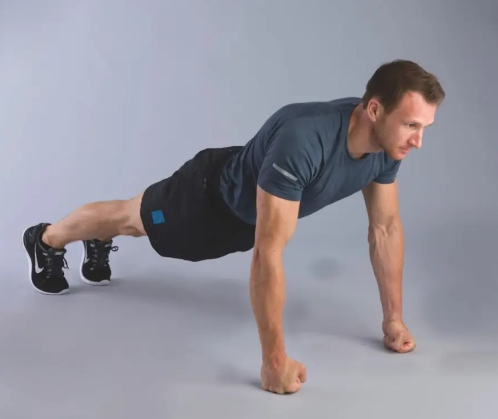 Man performing a knuckle push-up