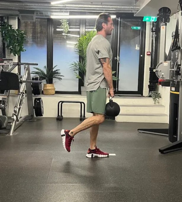 Man performing a single-leg Romanian deadlift