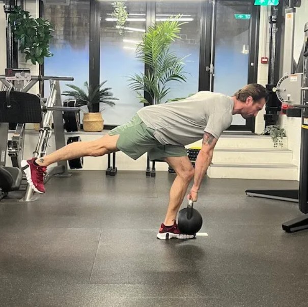 Man performing a single-leg Romanian deadlift