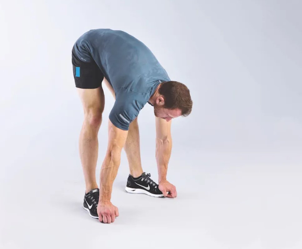 Man performing a squat to stretch