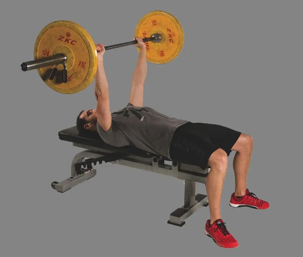 Man performing a barbell bench press