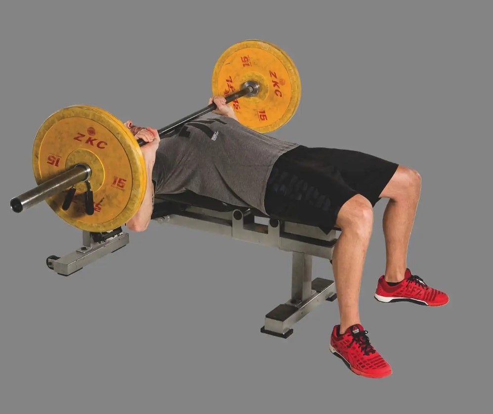 Man performing a barbell bench press