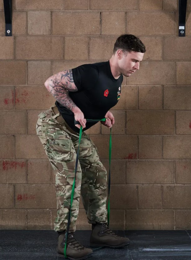 Man performing a banded bent-over row