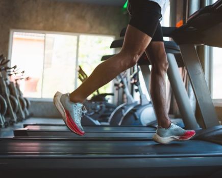 Close-up of a man's feet on a treadmill